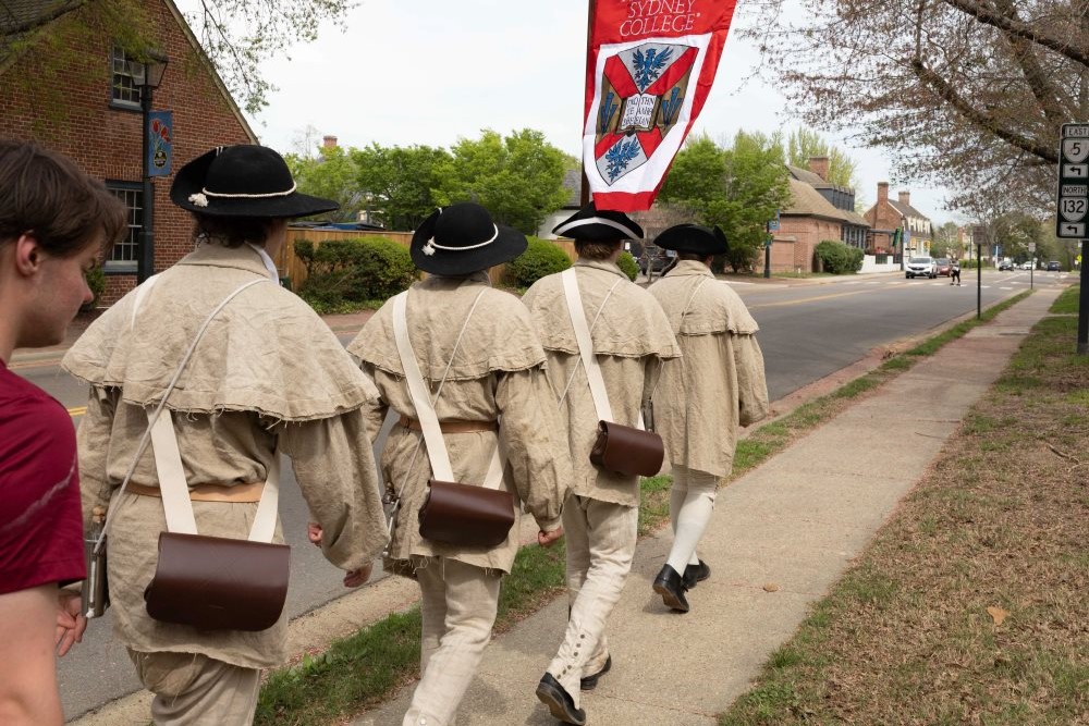 Hampden-Sydney students reenacting the March to Williamsburg in historic dress