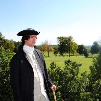 an actor dressed in Revolutionary era costume